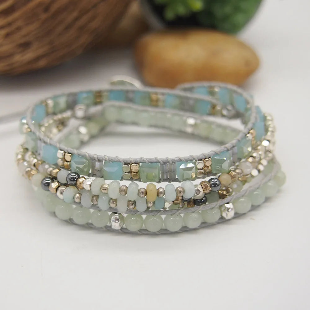 wrap beaded bracelet on a white surface with blurred background