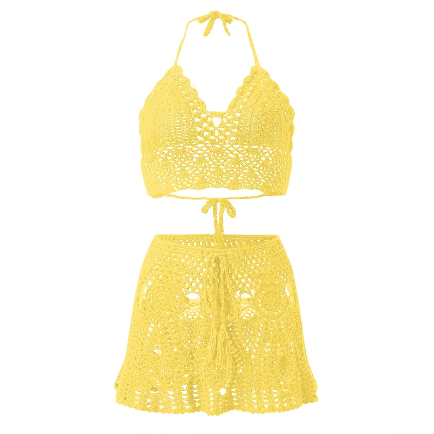 A bright yellow crocheted two-piece swimwear set featuring a halter crop top and a matching drawstring mini skirt, displayed against a solid white background.