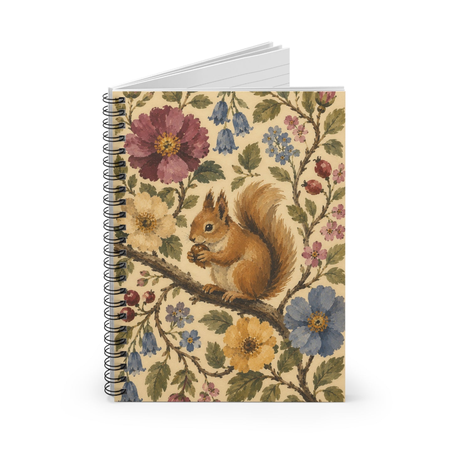 A notebook partially open and standing on a white background with a squirrel on a branch surrounded by vines and flowers