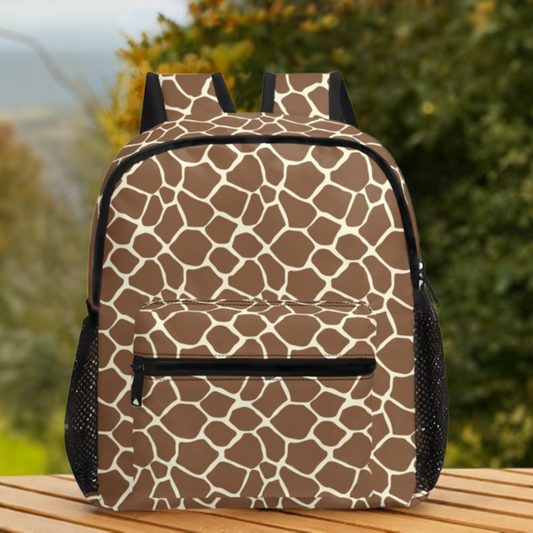 Giraffe print 11 inch backpack sitting on wooden table with trees and sky in the background